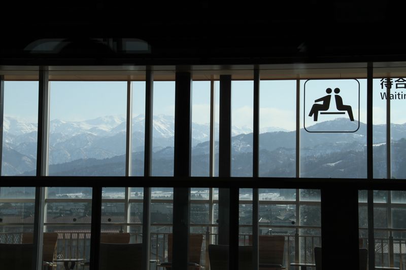 The waiting room at Kurobe-Unazuki Onsen Station affords a view of the Hida Range.