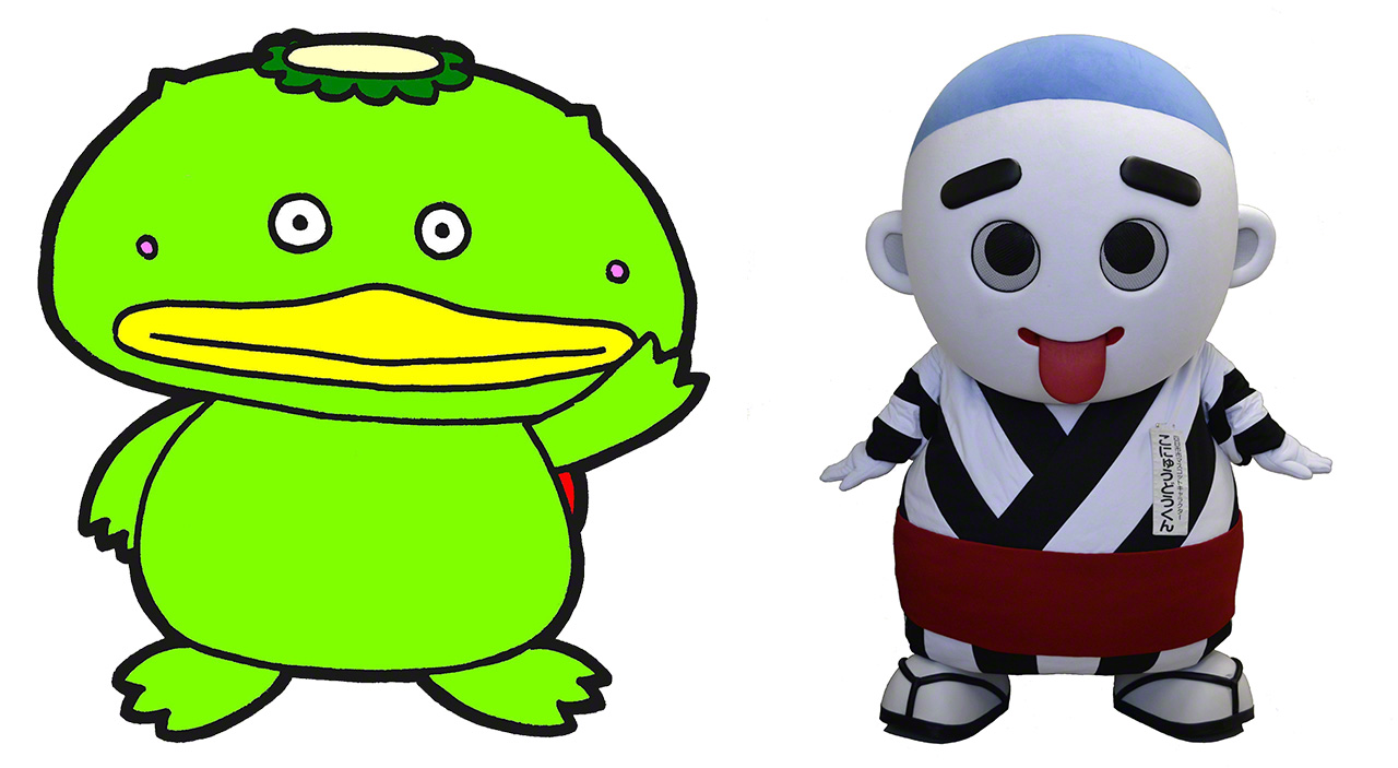 شخصية الصورة الرسمية ”كابال“ (يسار) لشركة الترويج الرياضي في مدينة شيكي في محافظة سايتاما، والتي ولدت بالنسبة إلى أسطورة كابَّا في نفس المدينة، وشخصية التميمة ”كونيودوكون“ في مدينة يوكايتشي في محافظة ميي، والتي تم تصميمها على هيئة أونيودو (عملاق روكوروكوبي) الذي يُعتبر أكبر عربة كاراكوري (عربة يتم جرها في المهرجانات) في اليابان، والتي تظهر في المهرجان الذي يقام في نفس المدينة (تقديم الصورة: شركة الترويج الرياضي في مدينة شيكي، مدينة يوكايتشي)