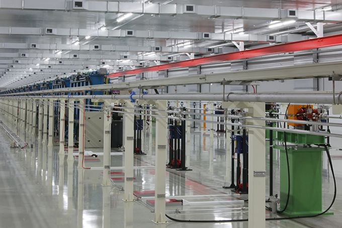 XFEL Undulator Hall; the XFEL is generated from the undulators lined up in the background of this photo.