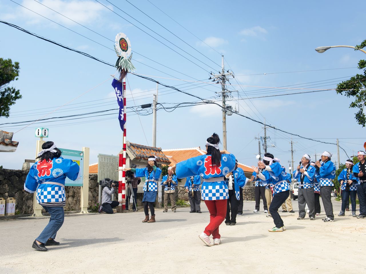 In a 2015 photo, people in a parade sing the <em>yunta</em>. The community acquired new <em>sudina</em> costumes for the festivities in autumn 2018.