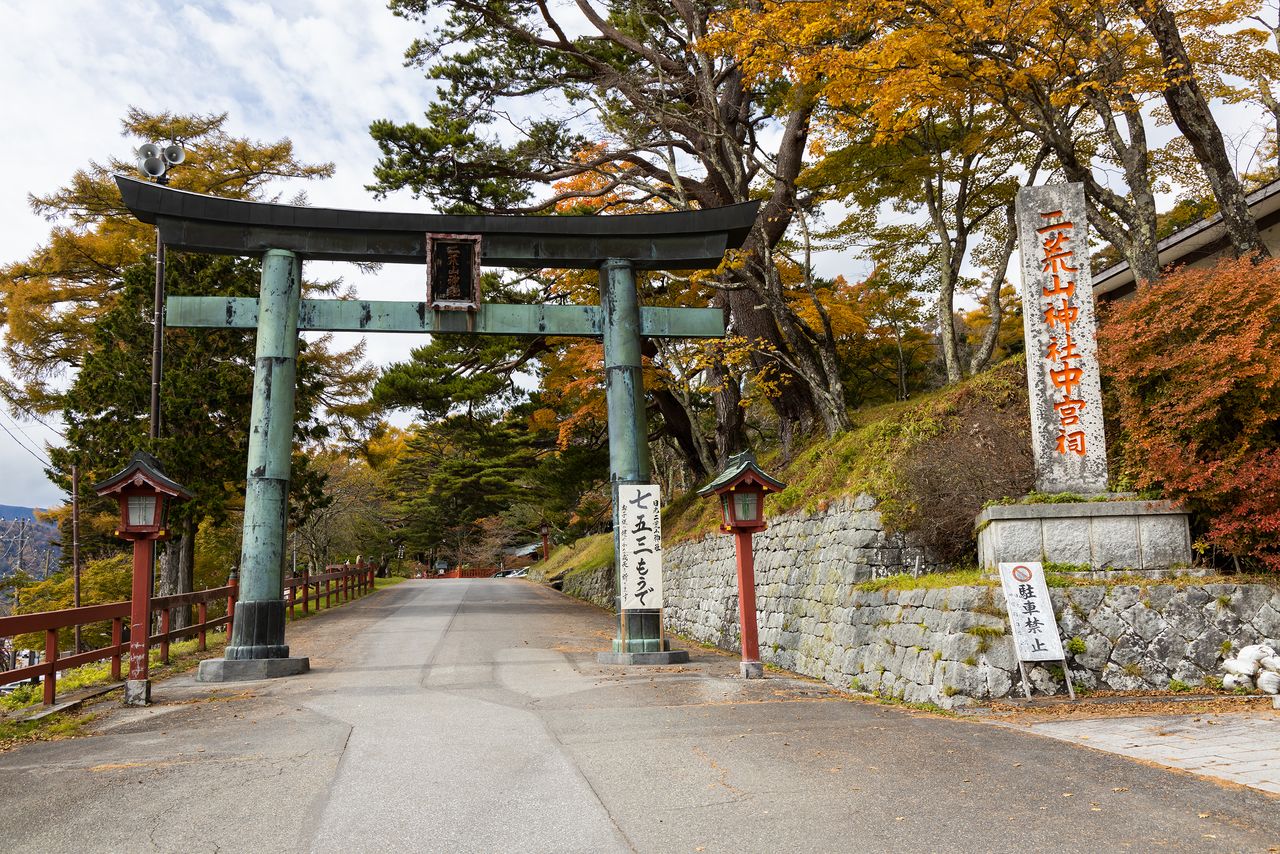 The east torii gate of Chūgūshi Shrine, located just off of National Route 120 on the north shore of Lake Chūzenji. 