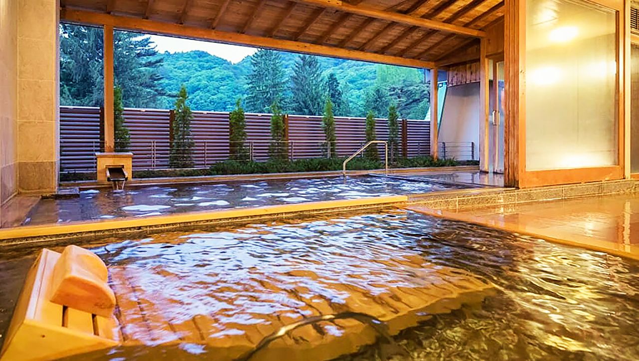The Hotel Hanamaki is popular for the view from its outdoor baths made of Japanese cypress. (Courtesy Hanamakionsen Co., Ltd.)