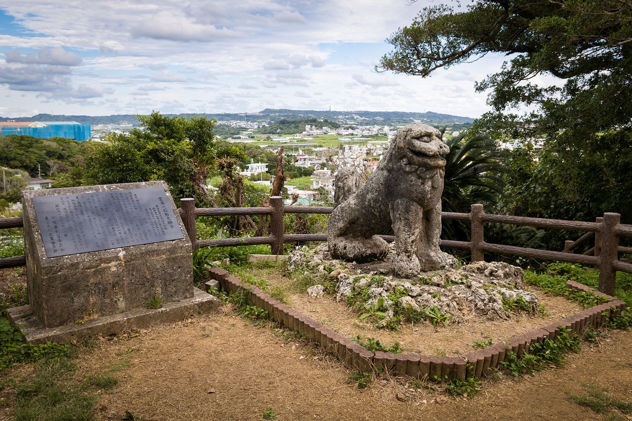 The stone lion of Tomori stands near the ruins of the castle Jirigusuku.