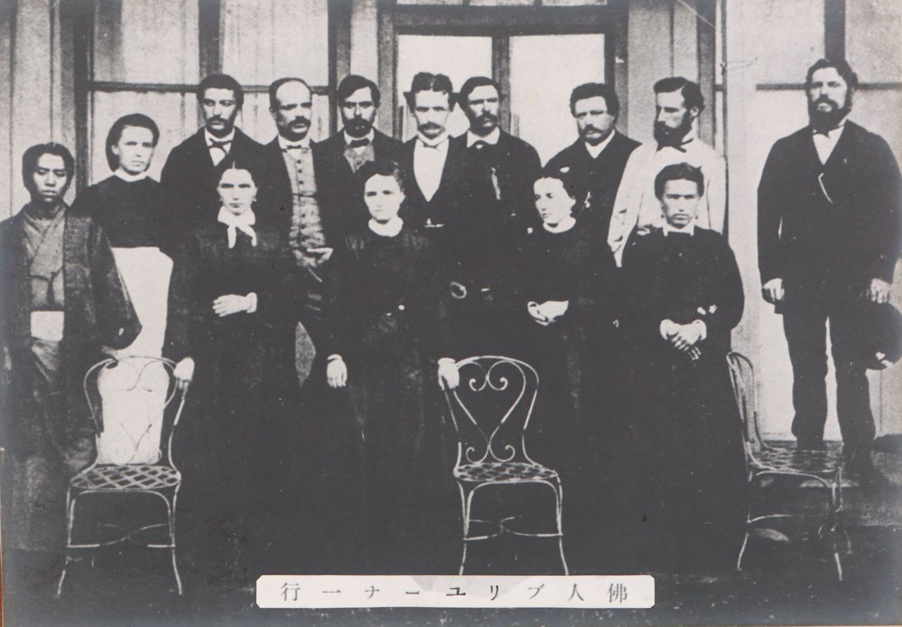Paul Brunat wearing a white jacket, back row, second from right. (Courtesy Tomioka Silk Mill)
