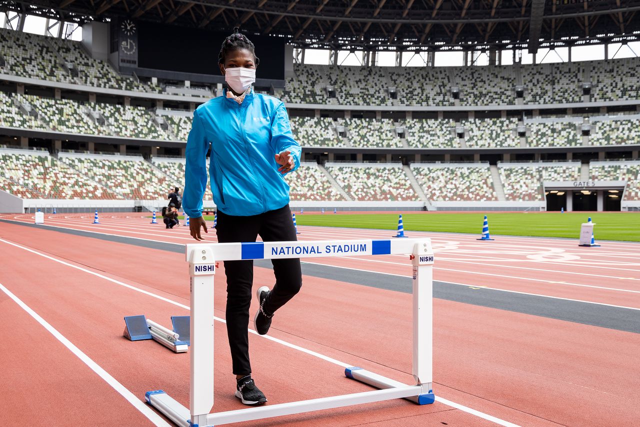 Participants can have their photos taken with hurdles and starting blocks on the athletics track.