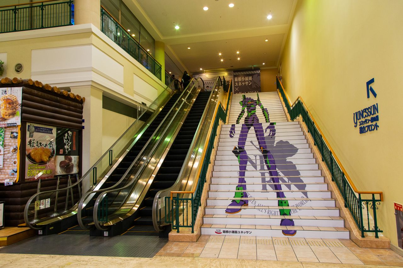 The long staircase up to reception features the EVA Unit 01.