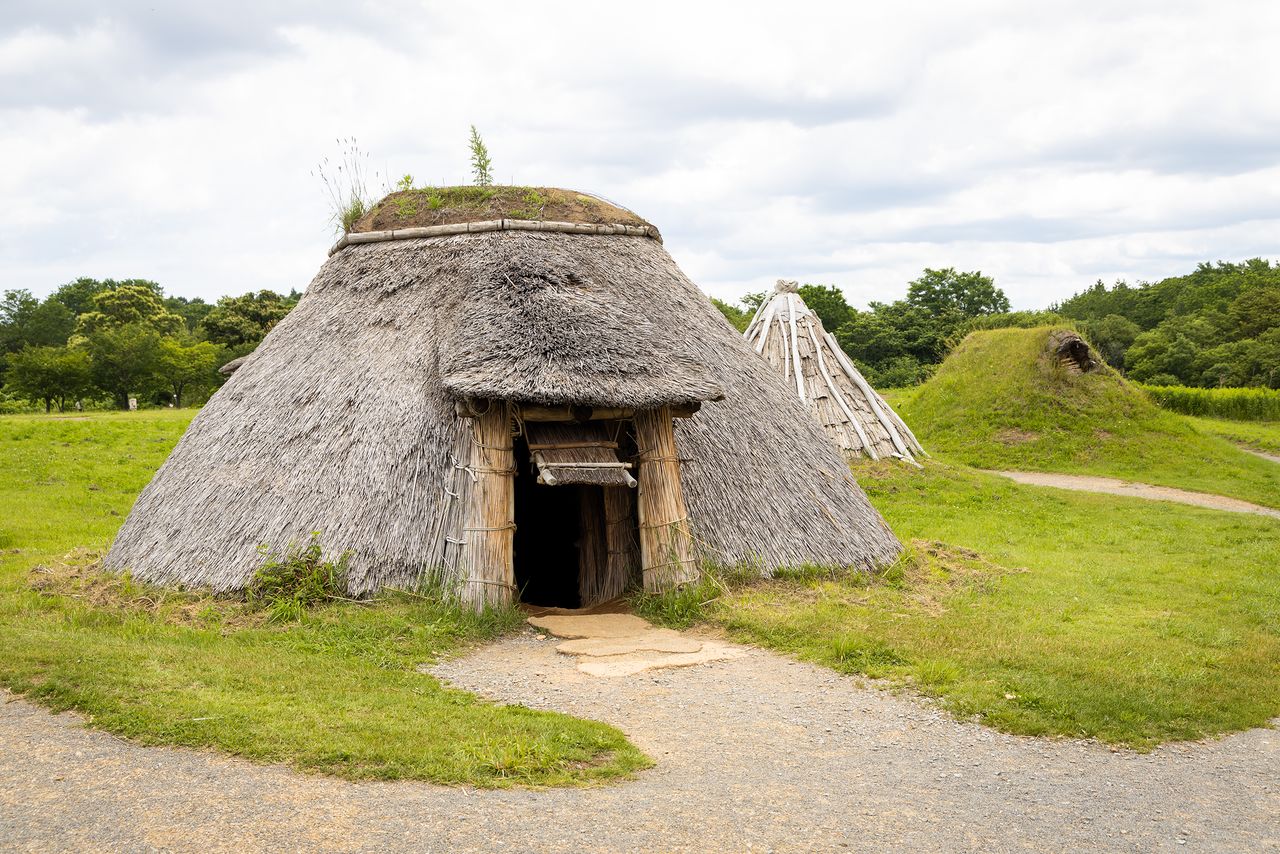 A reconstructed pit dwelling. These simple residences feature a fireplace in the center of the floor.