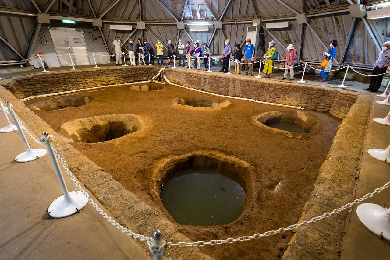 Visitors can view the pillar holes, which are preserved inside a protective dome.