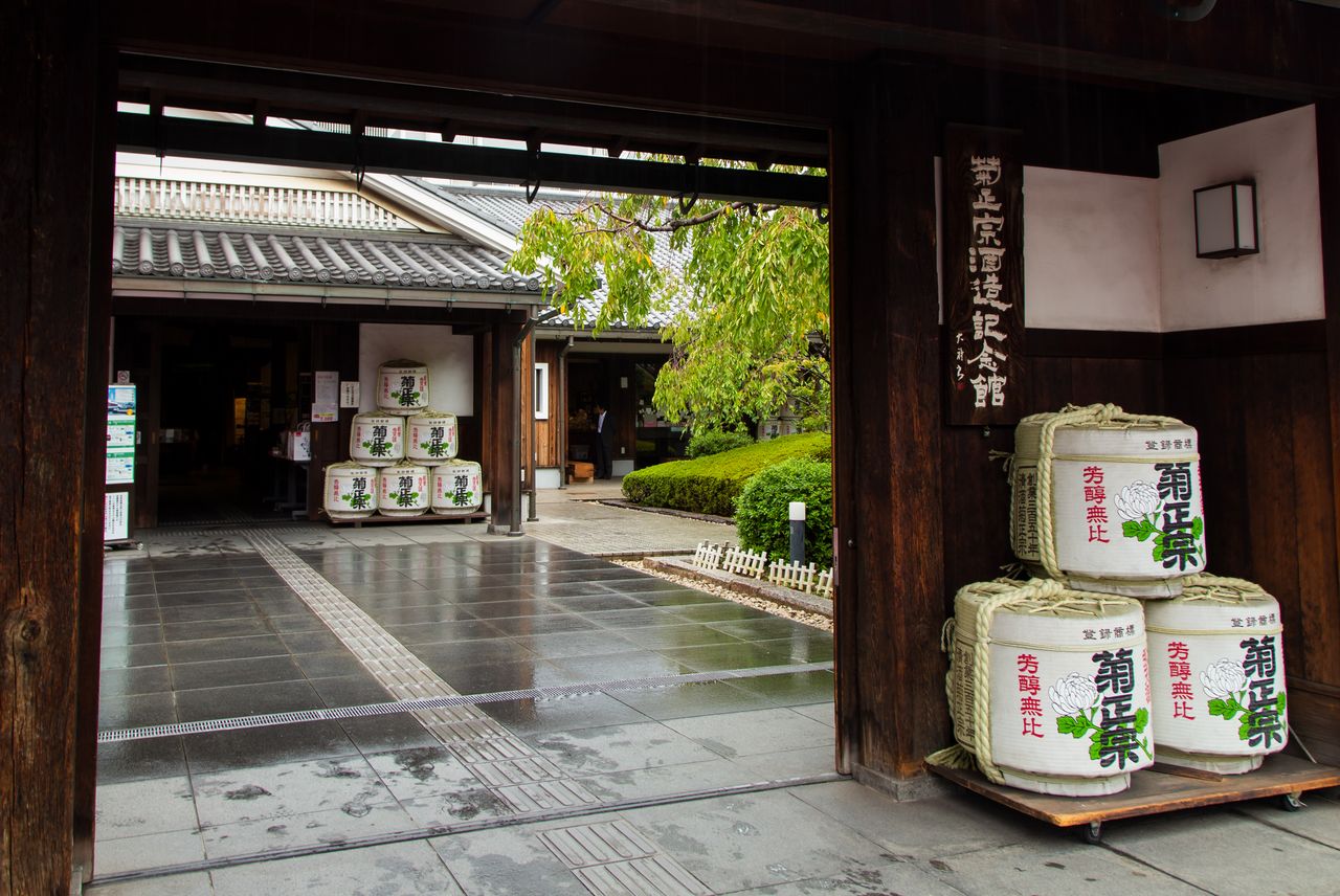 Barrels wrapped in decorative coverings at the entrance to the Kiku Masamune Sake Brewery Museum.