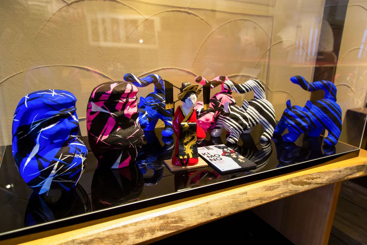 Tiger figures by Koshino Junko sport distinctive zebra stripes.