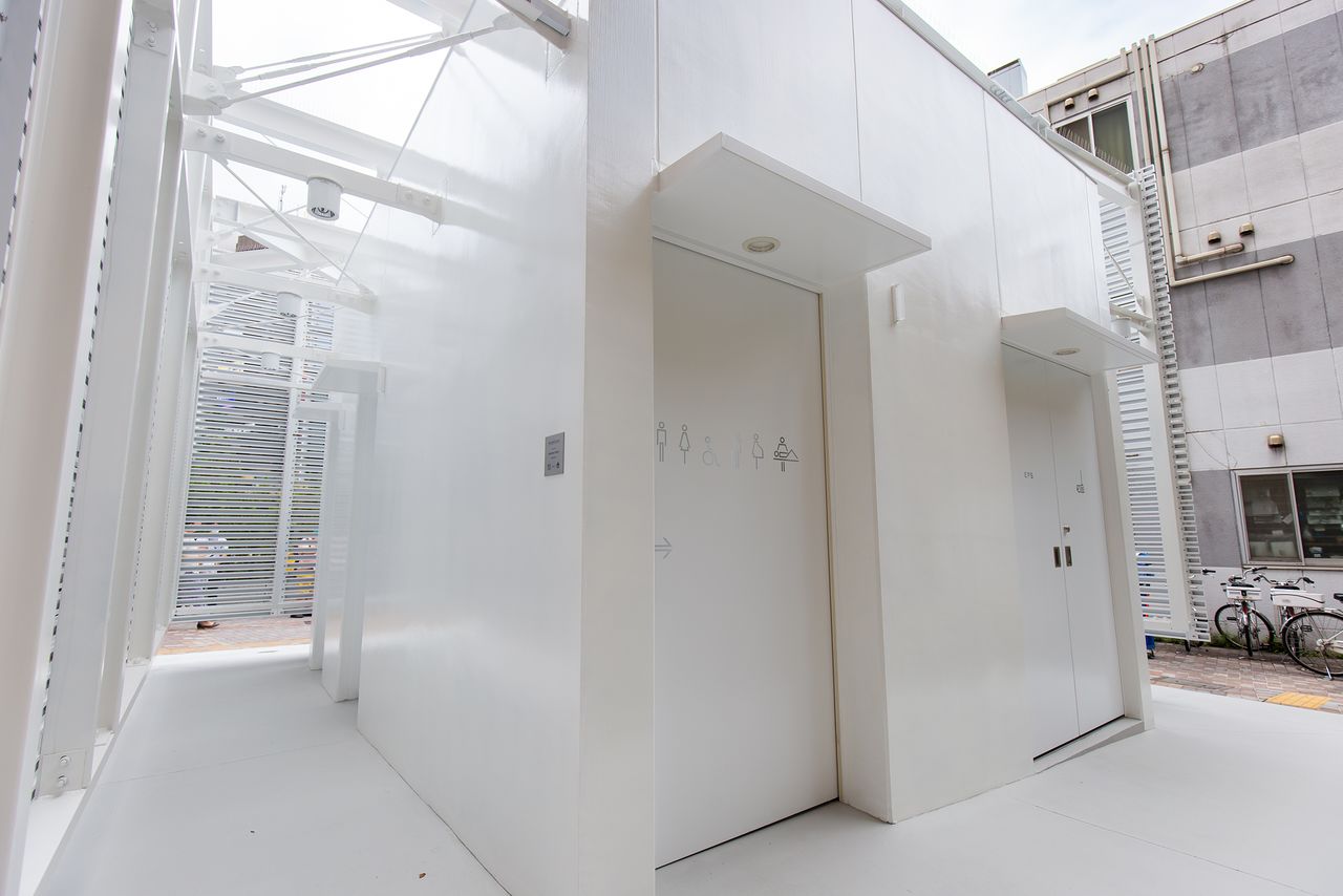 The entrance to the toilet is around the back, giving a degree of privacy in this busy station-front location. The louvers allow light to enter the access corridor.