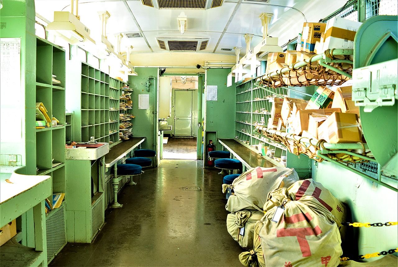 The mail sorting space inside the car. Stamped postcards placed in the mailbox there will be delivered with a special postmark.