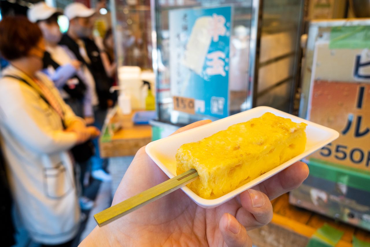 Sweet omelet on a stick makes the perfect dessert after enjoying seafood delicacies on offer in the outer market.