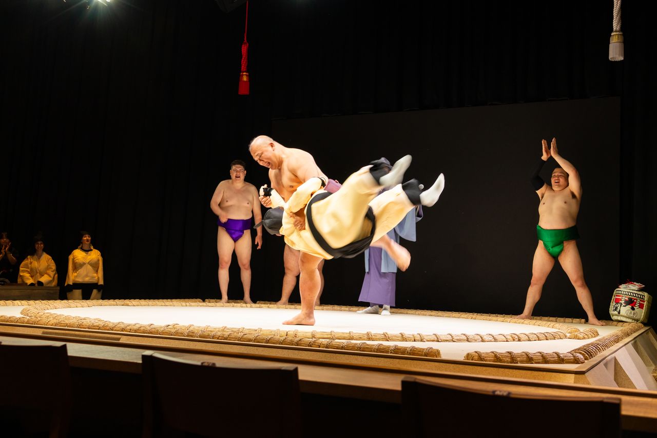 Women can also get thrown around in the ring; the padded sumō suit gives some protection. (© Nippon.com)