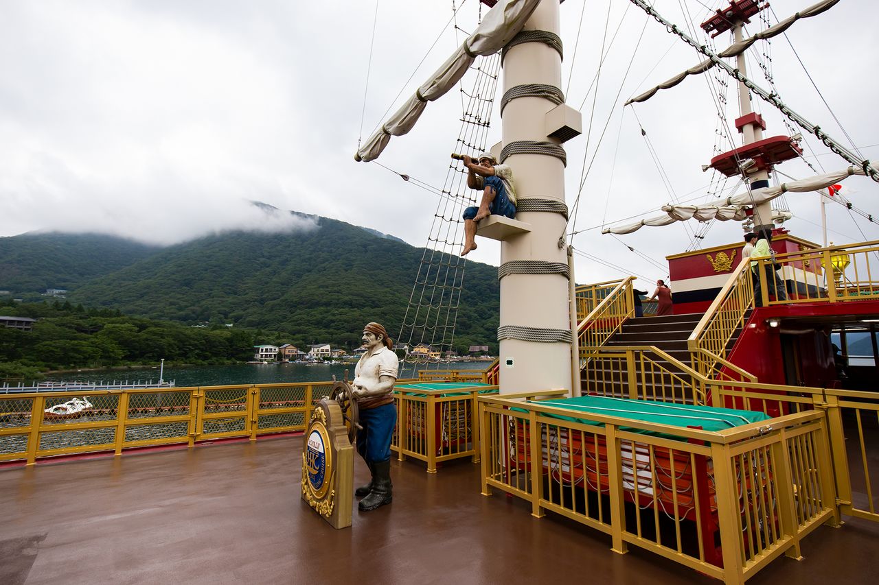 Statues of a helmsmen and guard add to the décor on the deck of the Royal II.