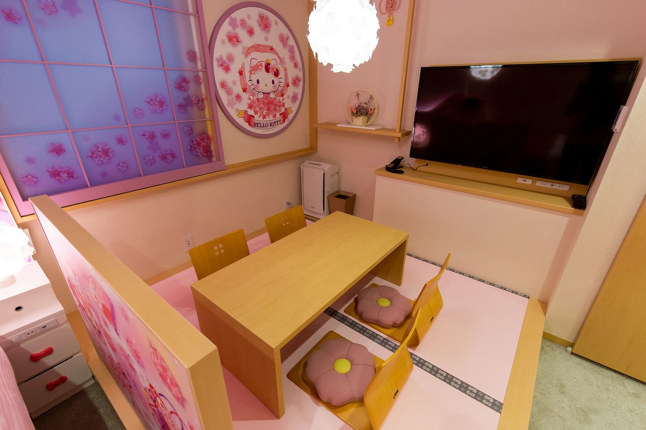 The seats in the pink tatami area have cherry blossom-shaped cushions.