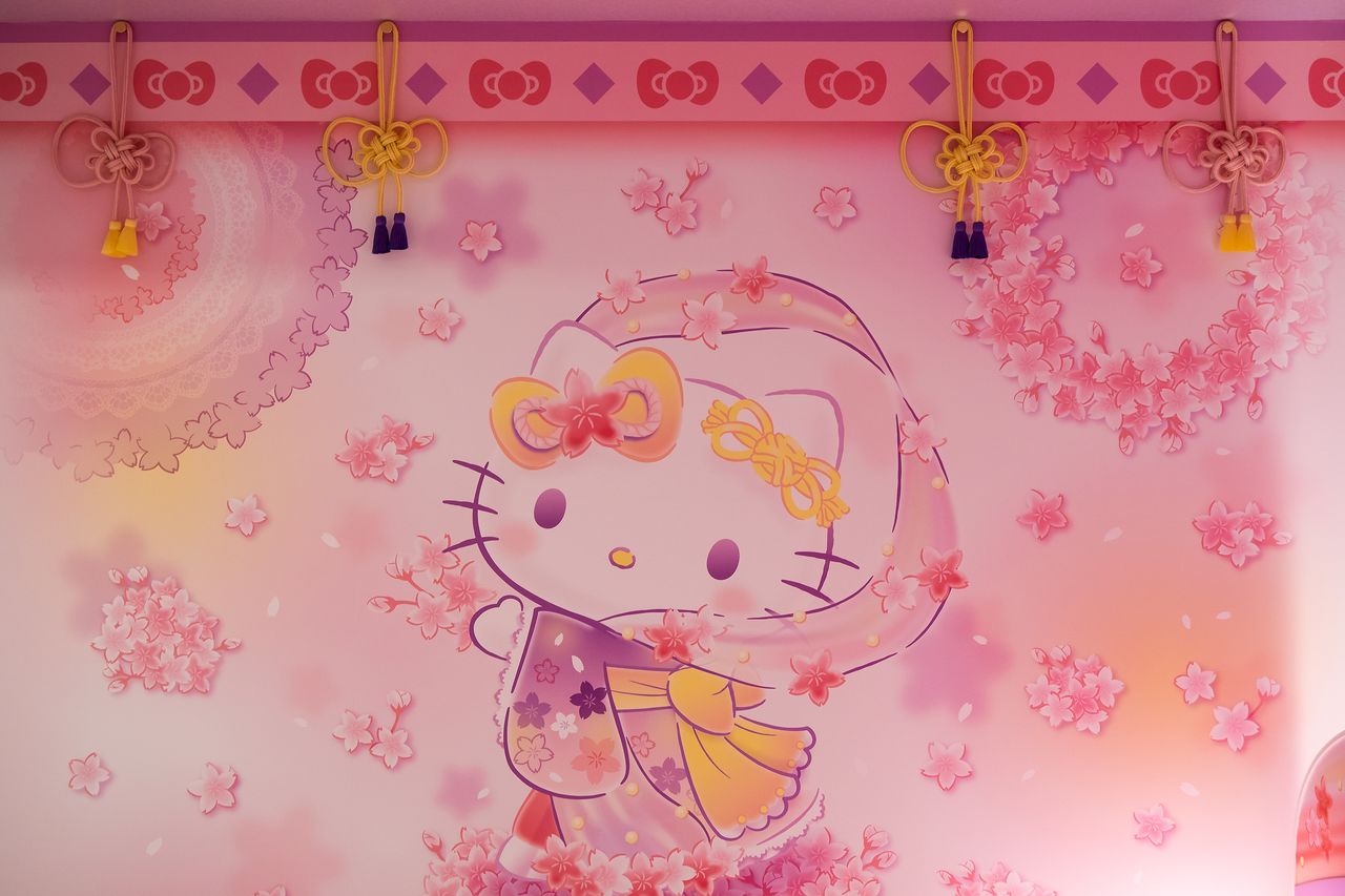 Traditional kumihimo braided cords hanging from the ceiling are shaped into Hello Kitty bows.