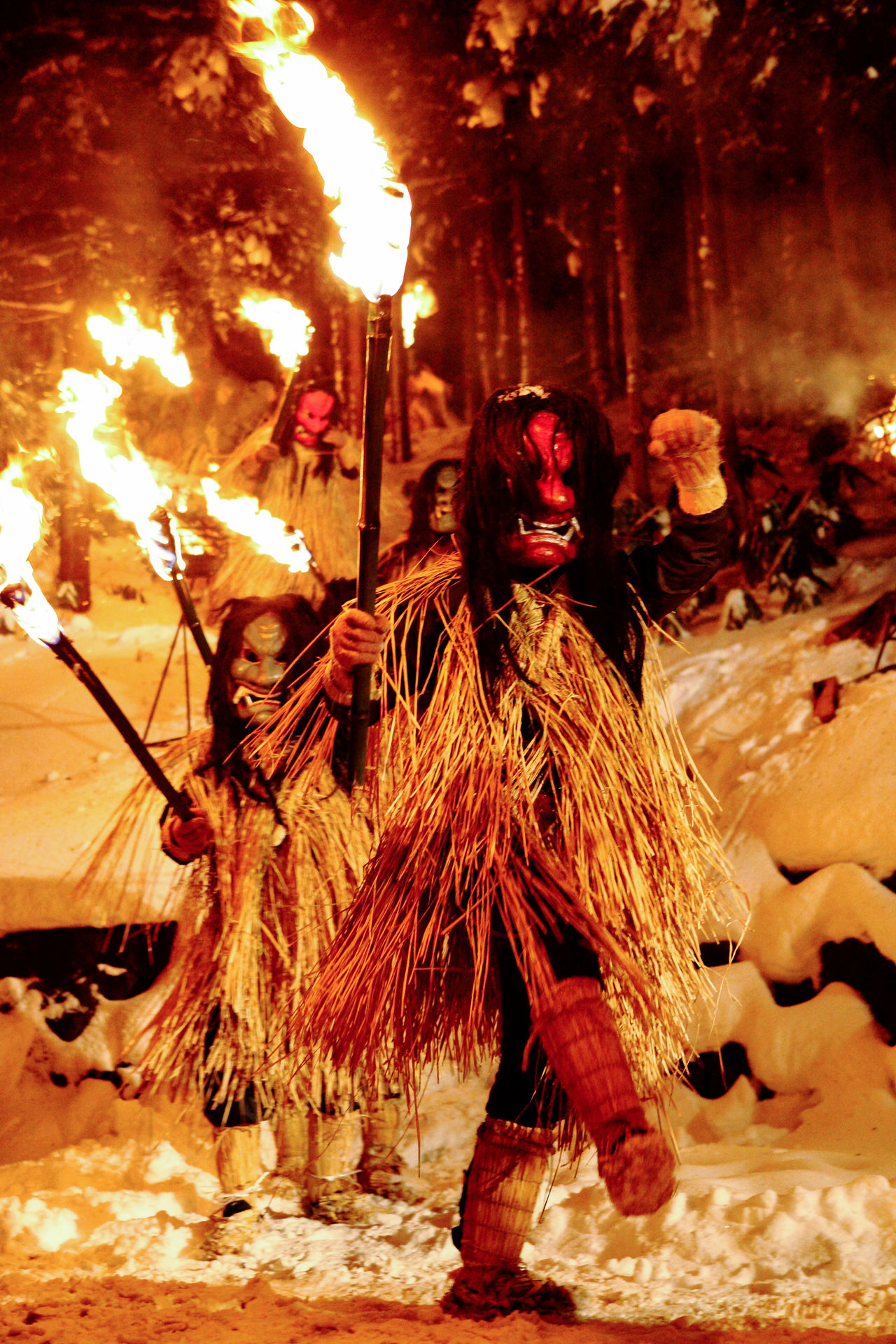 <em>Namahage</em> bearing flaming torches in the Sedo Festival. 