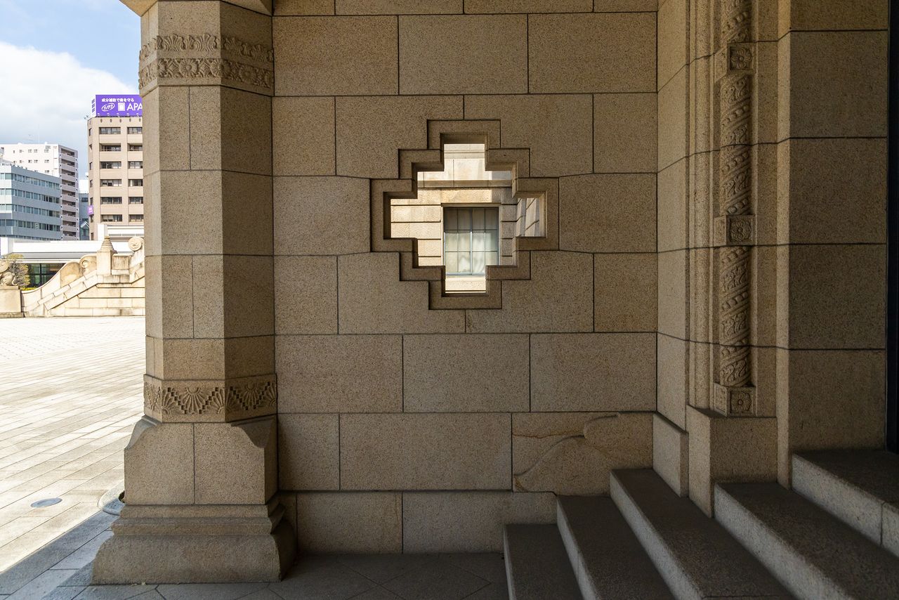 A geometric design in a wall near the entrance.