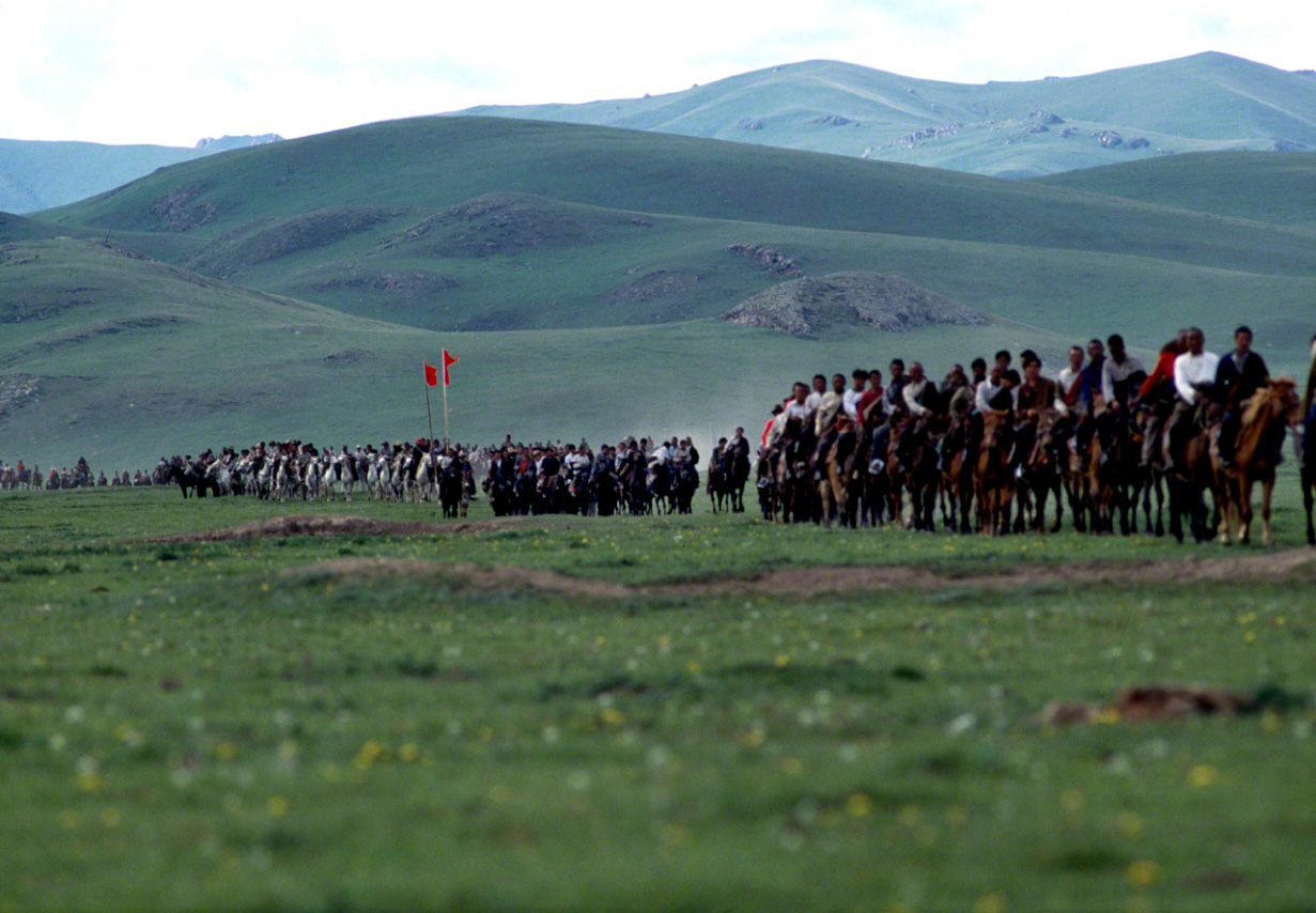 A line of nomads waits for the arrival of a lama to conduct religious ceremony on the plateau. Taken in 1988 in an area of the Szechuan highlands that was once a stronghold of the Red Army. Crossing these plains was one of the biggest hardships on the Red Army’s Long March. (From Dreams and Reality of the Long March)