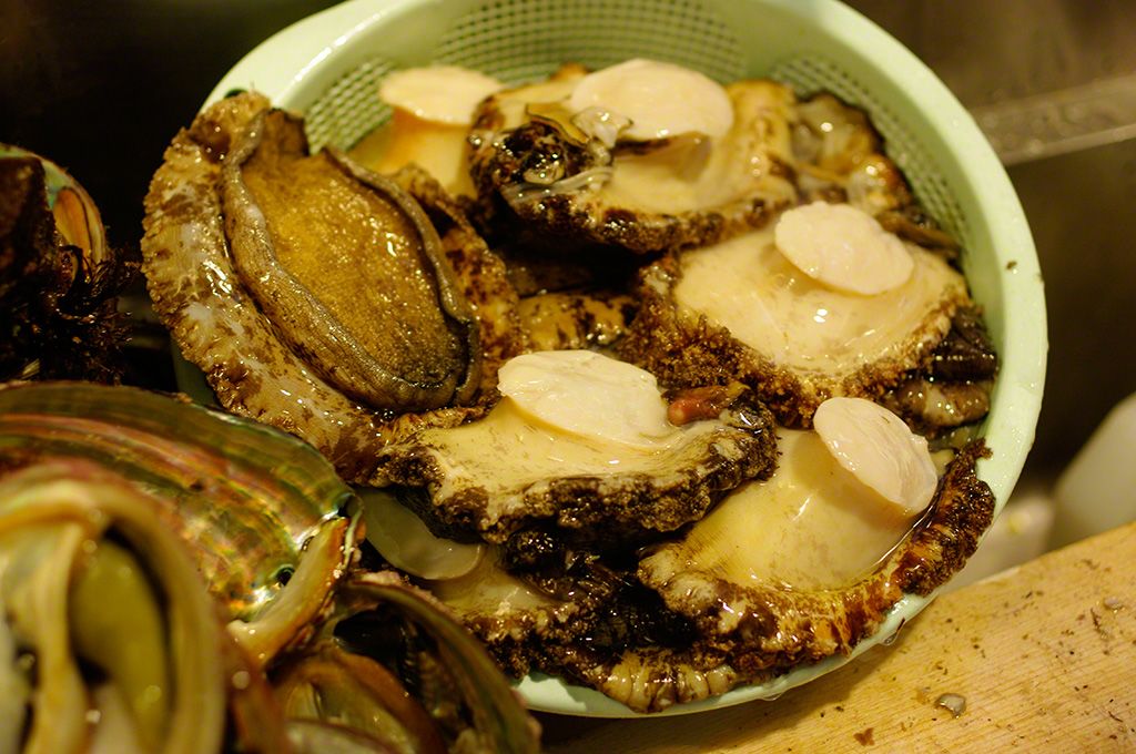 The finest-quality abalone are selected from the Tsukiji fish market and cleaned by hand.