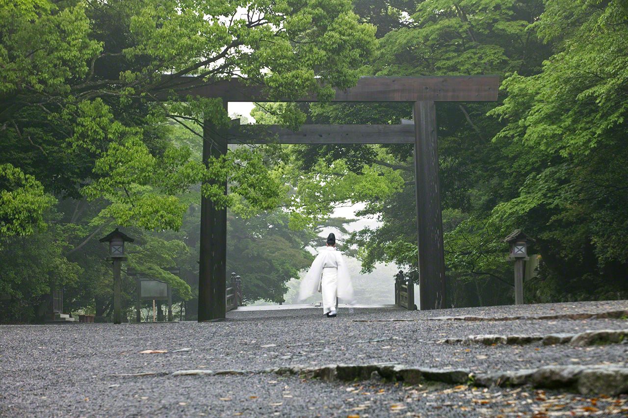 May 16<br>A priest does the rounds of the sacred precincts every morning, his white robes standing out beautifully against the fresh verdure of spring.