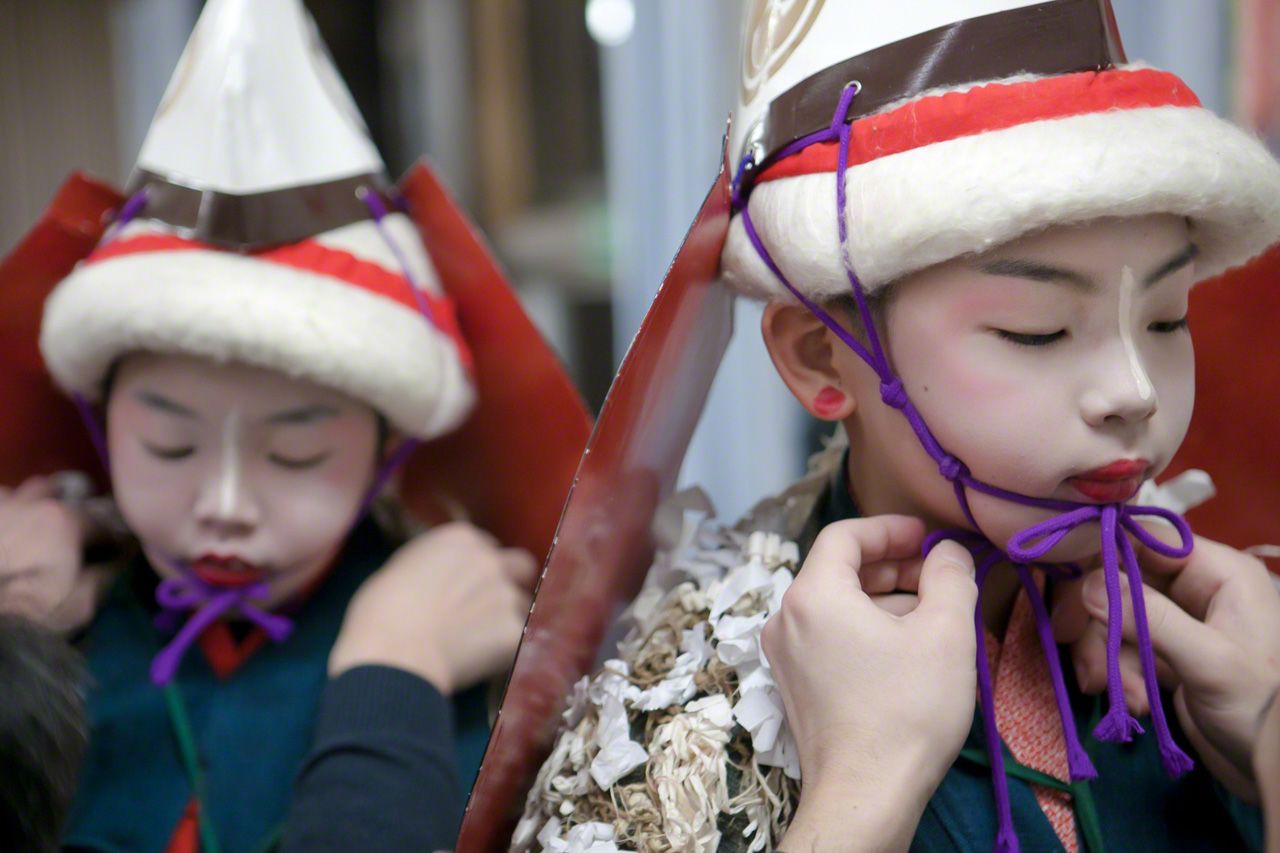 Children preparing for the Torimai (bird dance).
