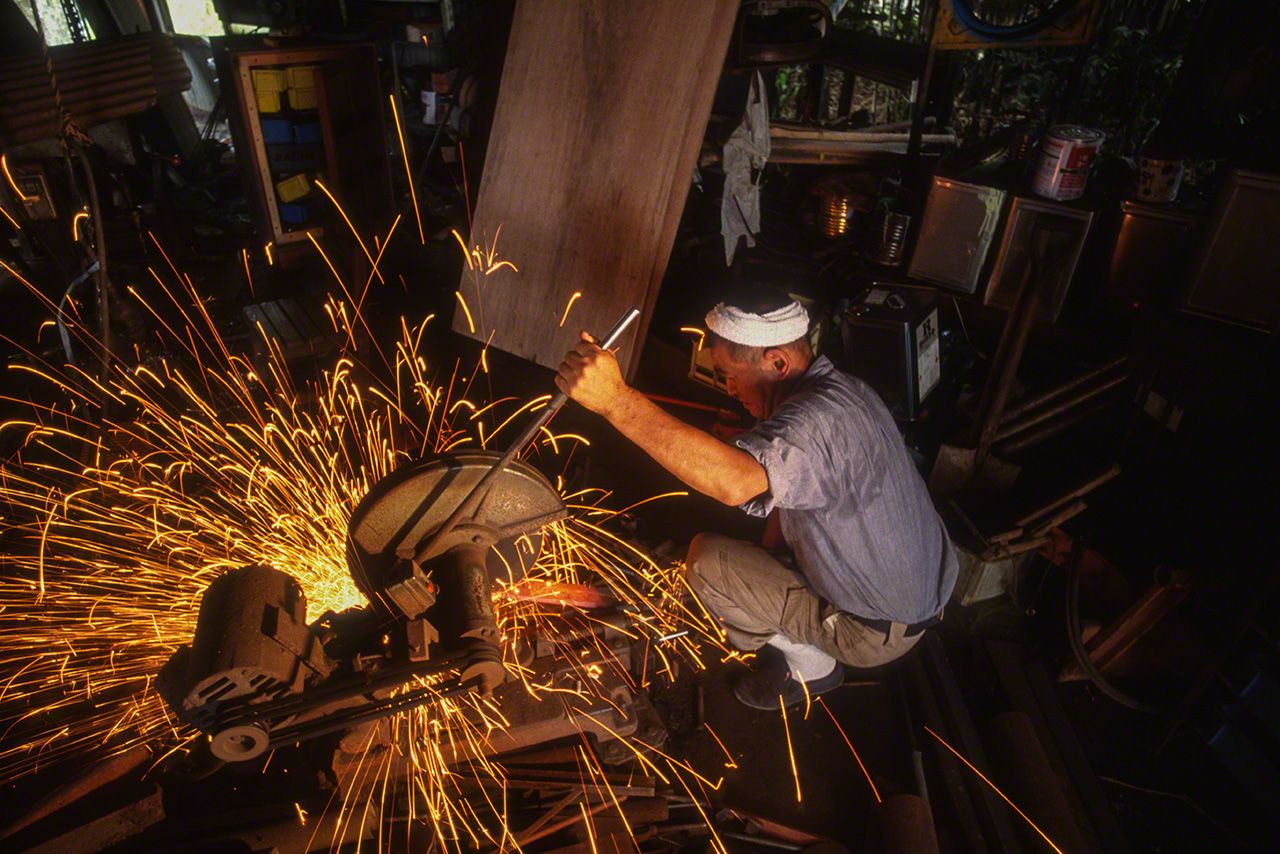 Sparks fly like a firework display when cutting metal at the Nosaka Kajiten blacksmith in Nyūzen, Toyama Prefecture.