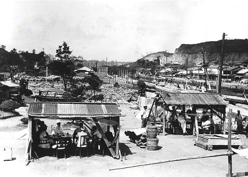 The barracks-style guards’ quarters. A derailed tram can be seen in the distance.