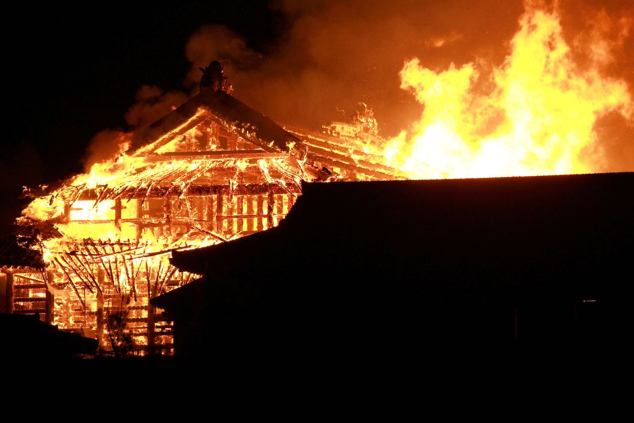 A fire causes destruction at Shuri Castle in Naha on October 31, 2019. (© Jiji)