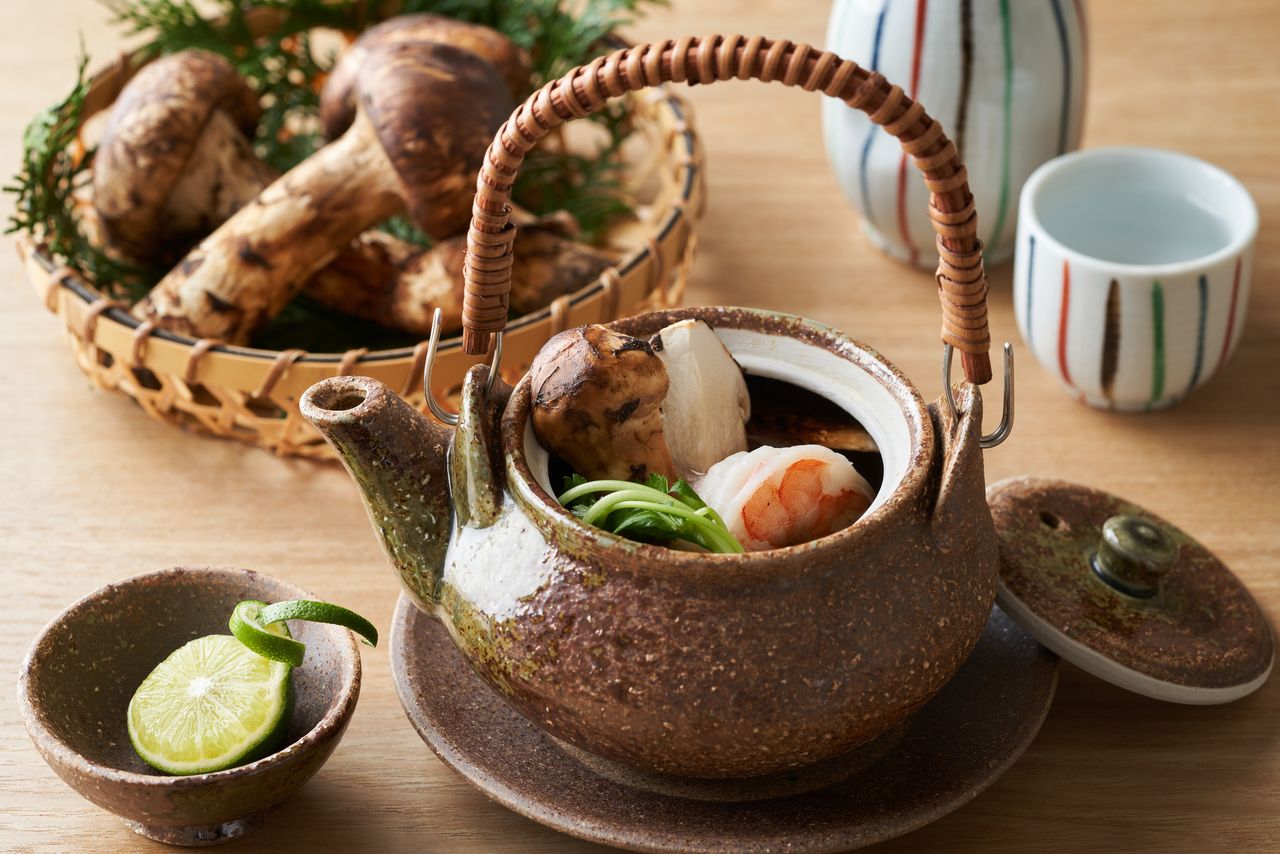 An elegantly arranged dobin-mushi consisting of matsutake, shrimp, and gingko nuts steamed in dashi, with a dash of fragrant sudachi.
