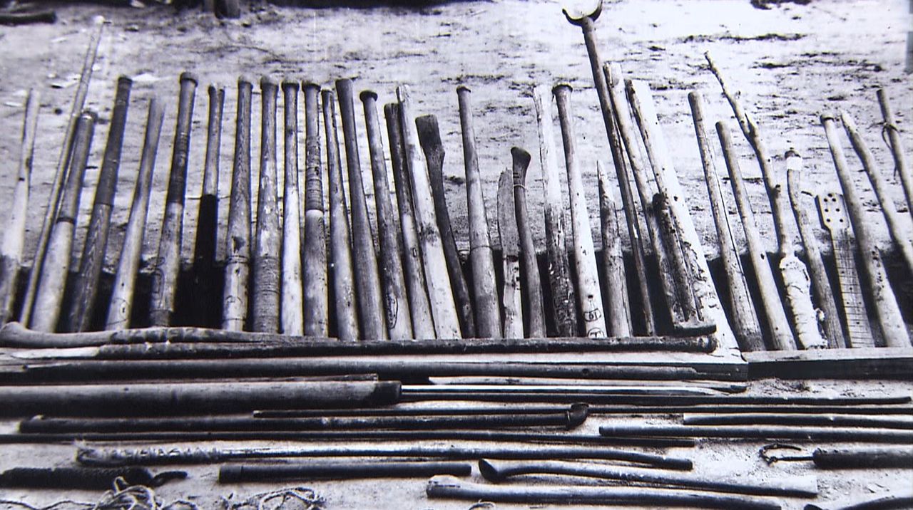 Baseball bats made by the prisoners. In the uprising, they wielded these against guards, who were armed with machine guns. (© Setonaikai Broadcasting Corporation)