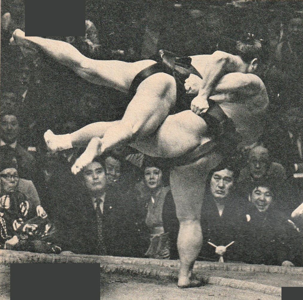 At the March 1972 basho, Kotozakura (right) executes a yaguranage, throwing opponent Takanohana clear into the ringside seats. (Courtesy Ōzumō Journal)