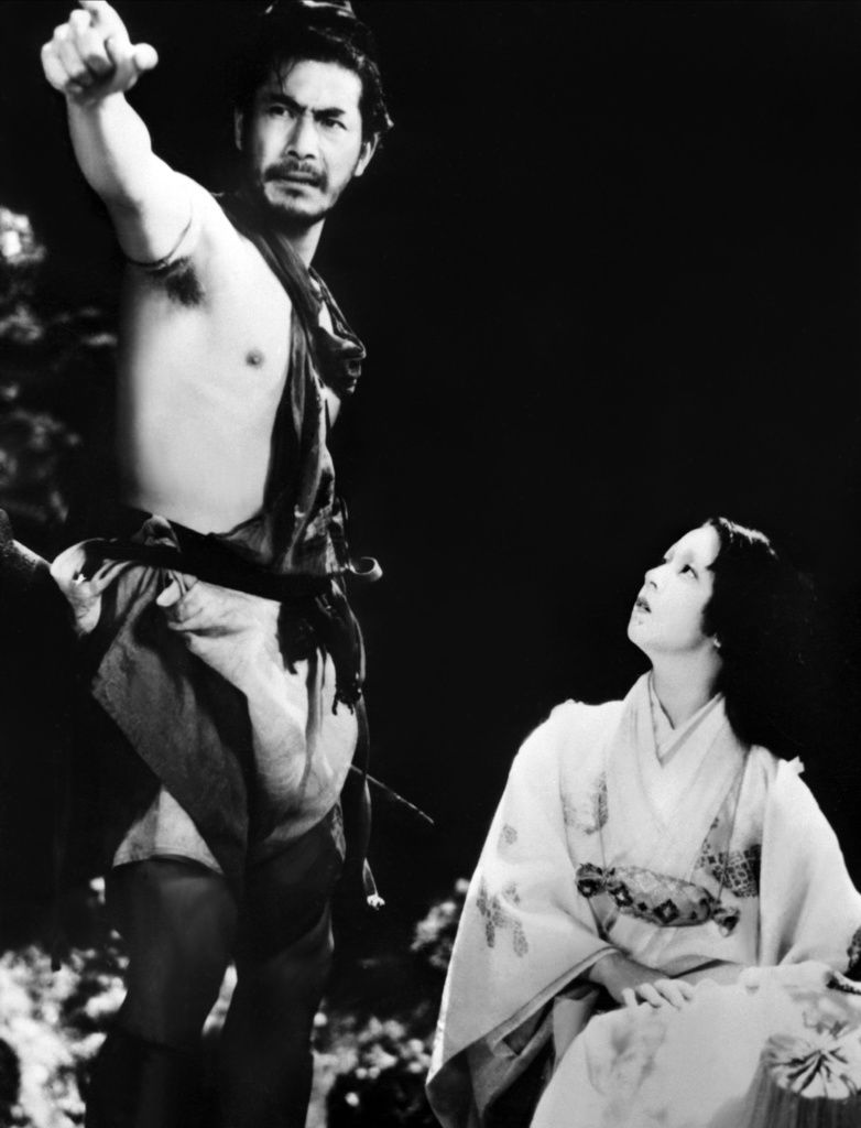 A scene from Rashōmon, with Mifune Toshirō playing the bandit and Kyō Machiko the samurai’s wife. (© Kyōdō)