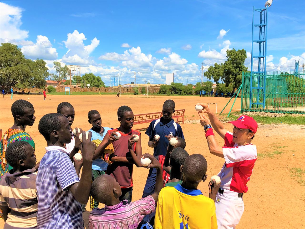 Playing with rubber balls, usually the first type of balls children encounter in South Sudan.  (Courtesy of Tomonari Shin'ya)