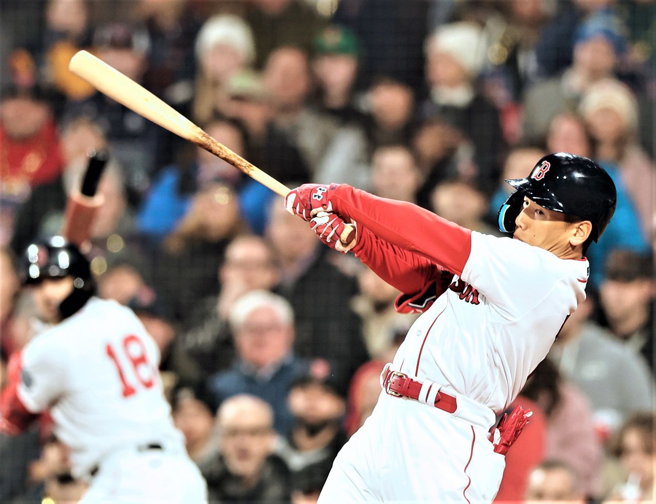 The Red Sox’s Yoshida Masataka hits a tape-measure shot for his first MLB home run in a game at Boston’s Fenway Park on April 3, 2023. (© Jiji)