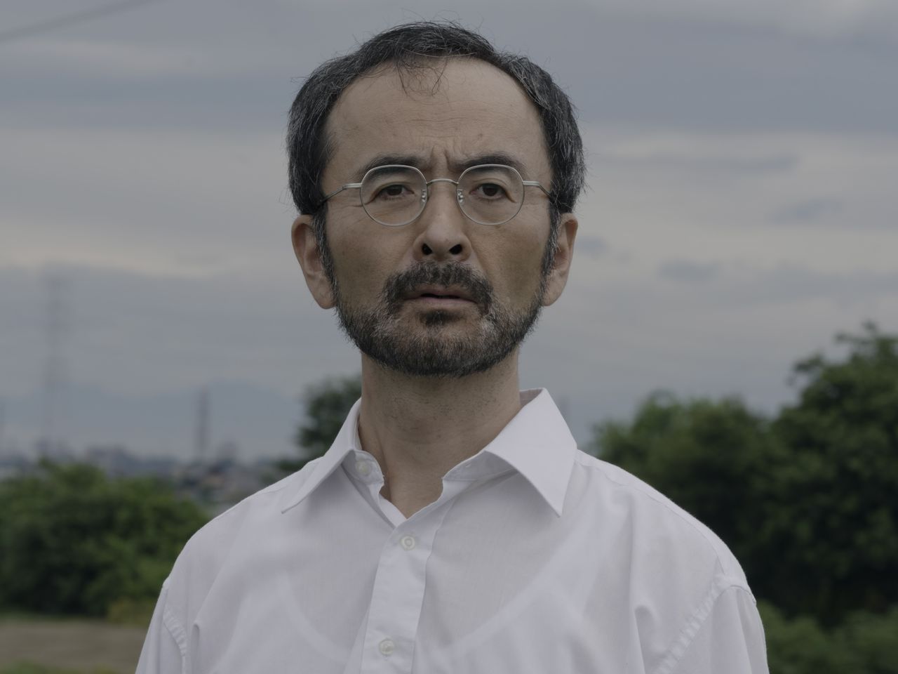 Actor Furutachi Kanji plays the part of Kirishima from middle age on. (© Escape Production Committee 2025)