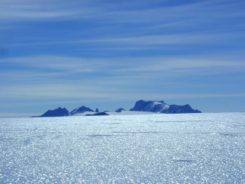 Martian meteorite Yamato 000593 was discovered on the 2-kilometer-thick sheet of blue ice that surrounds the Yamato Mountains. The first nine meteorites discovered by Japanese explorers in 1969 were also found here. (Courtesy the National Institute of Polar Research)