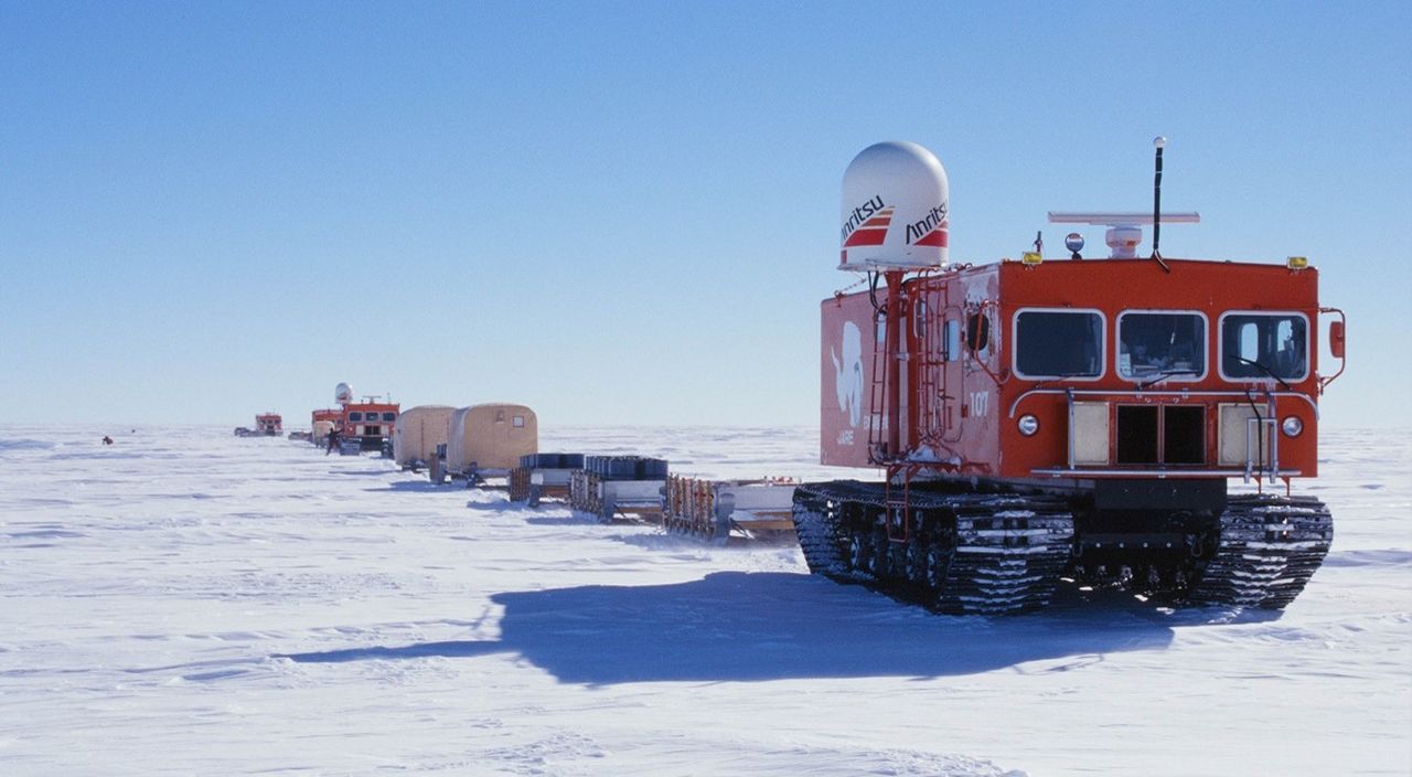 Three snowcats pulled a total of 22 sleds on the search for meteorites. (Courtesy the National Institute of Polar Research)