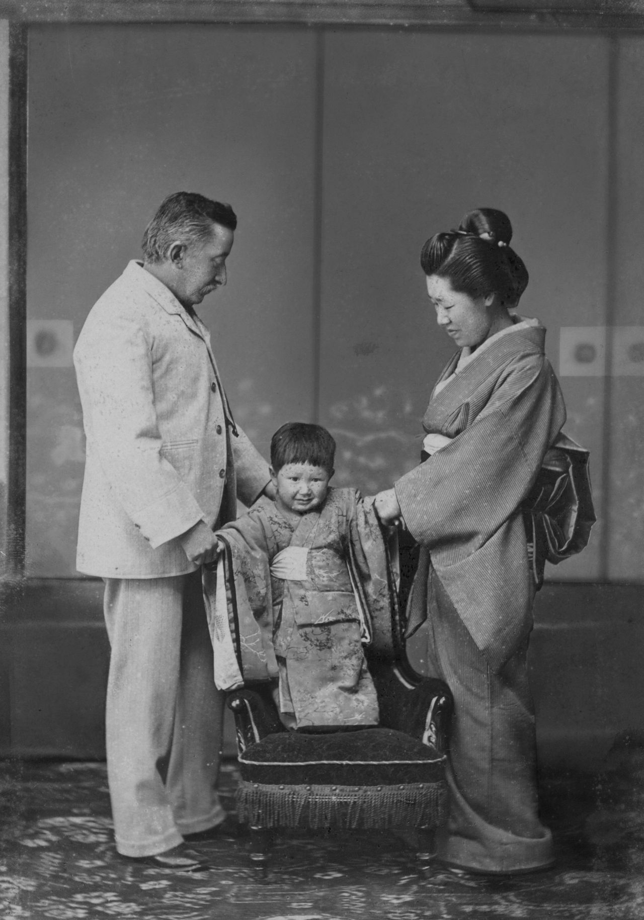 A commemorative photograph of Hearn and Setsu with their oldest son Kazuo, celebrating Shichi-Go-San around 1896. (© Lafcadio Hearn Memorial Museum)