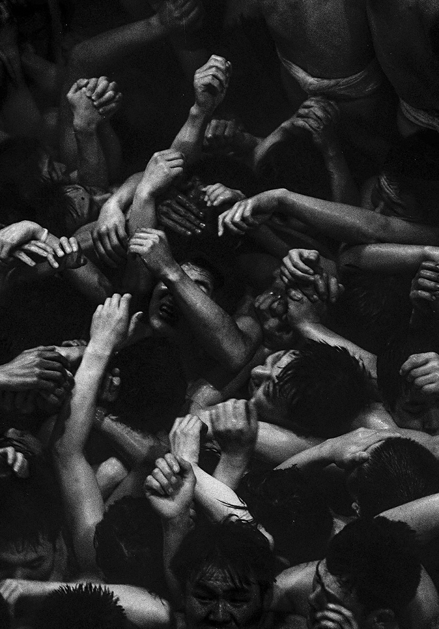 Saidaiji eyō: The yearly February eyō ritual of the temple Saidaiji is known for its hadaka “naked” festival. The energy of the naked men grappling to get hold of the shingi sacred amulet comes through well in this photo. Okayama Prefecture, 1979. (© Haga Hideo)