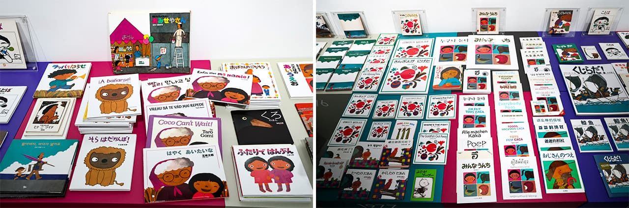 Visitors can pick up and read the books on display at the exhibition. The first translation of a Gomi picture book was Coco Can’t Wait, which was published in the United States in 1979 (later published under the title I Really Want to See You, Grandma) (center of photo at left); The Goldfish Got Away and Everyone Poops, visible in the collection at right, have appeared in a number of languages. (© Hanai Tomoko)