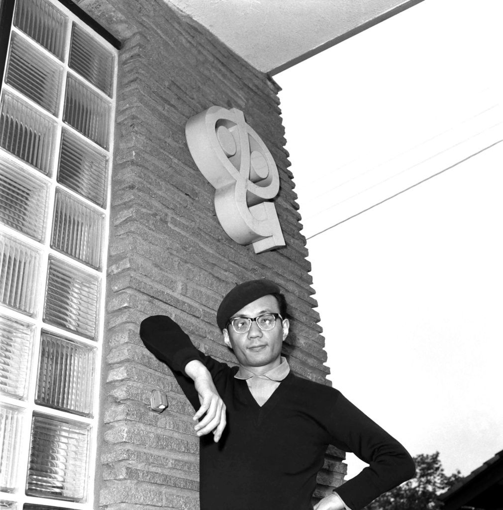 Tezuka Osamu poses in front of Mushi Production on May 13, 1963. (© Kyōdō)