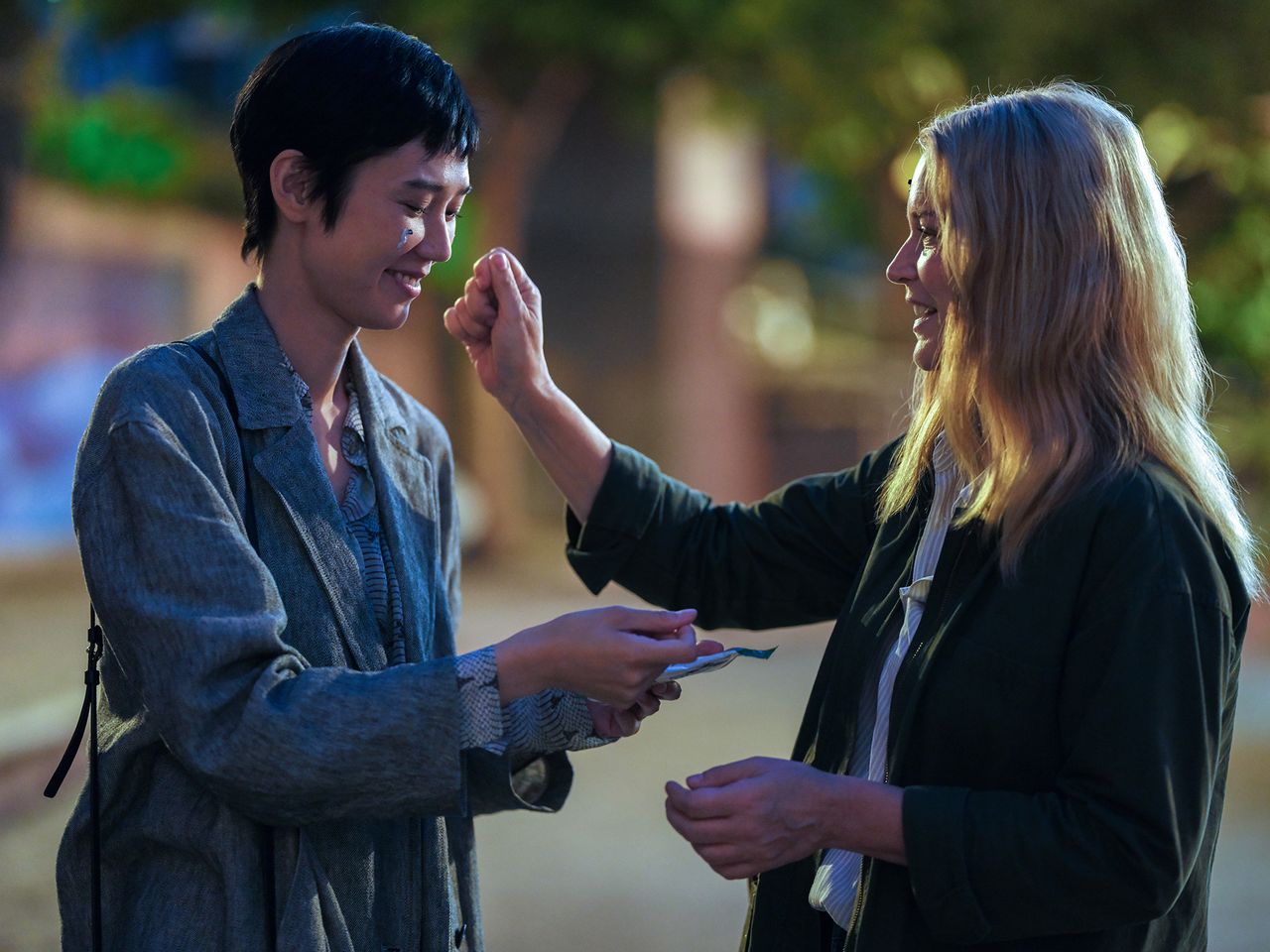 The film’s main characters, Marie-Lou (Virginie Efira, at right), and Mari (Okamoto Tao), quickly warm to each other.
