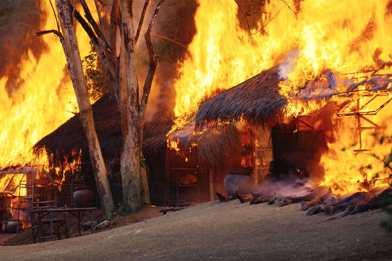 A village is burned to the ground at the end of a US sweep operation. (© Mr. Nelson, Did You Kill People? Film Partners; © Allen Nelson/Kōdansha)