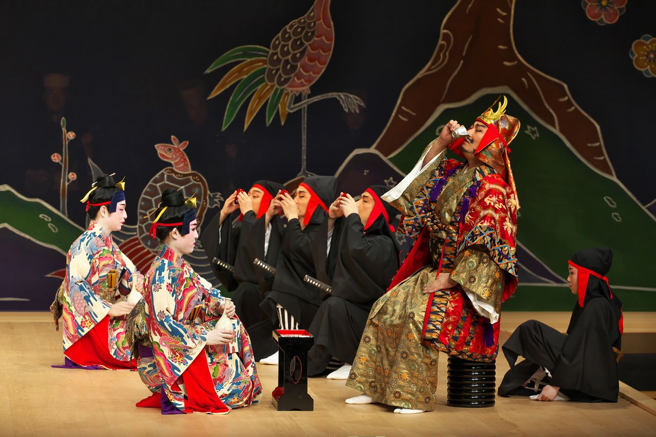 A scene from Nidō tekiuchi. Burning with an ambition to seize control of the kingdom, Amawari (right) destroys his rival Gosamaru, who is avenged by his two sons (left). (Courtesy of the National Theater Okinawa)