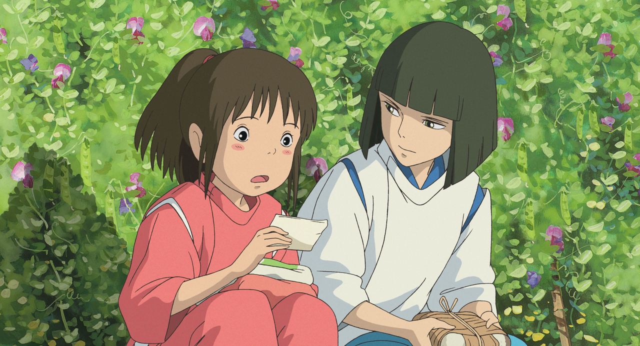 Chihiro with Haku in the bathhouse garden. (© 2001 Studio Ghibli/NDDTM)