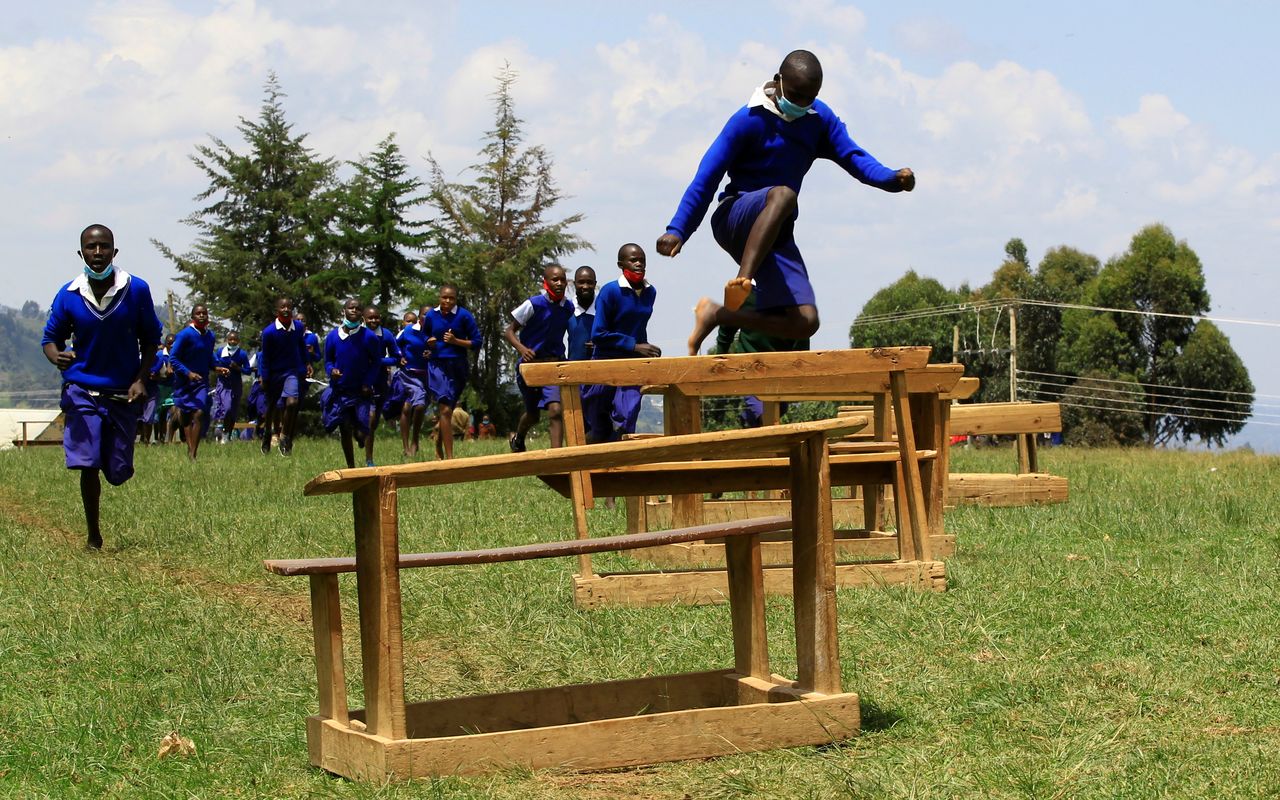 Pupils at Chesubet Primary school which produced 3,000 meters steeplechase gold champions in the past Olympics compete during a steeplechase exercise session at the school