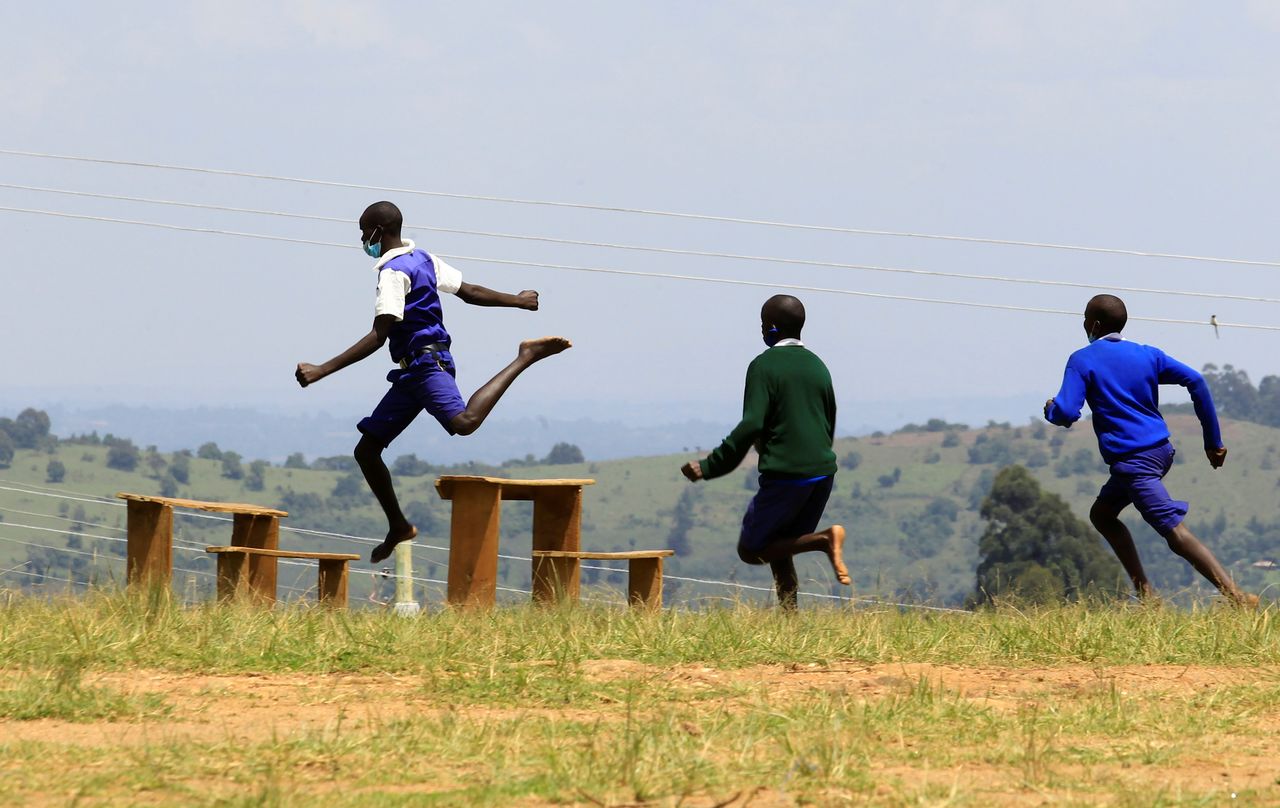 Pupils at Chesubet Primary school which produced 3,000 meters steeplechase gold champions in the past Olympics, compete during a steeplechase exercise session at the school