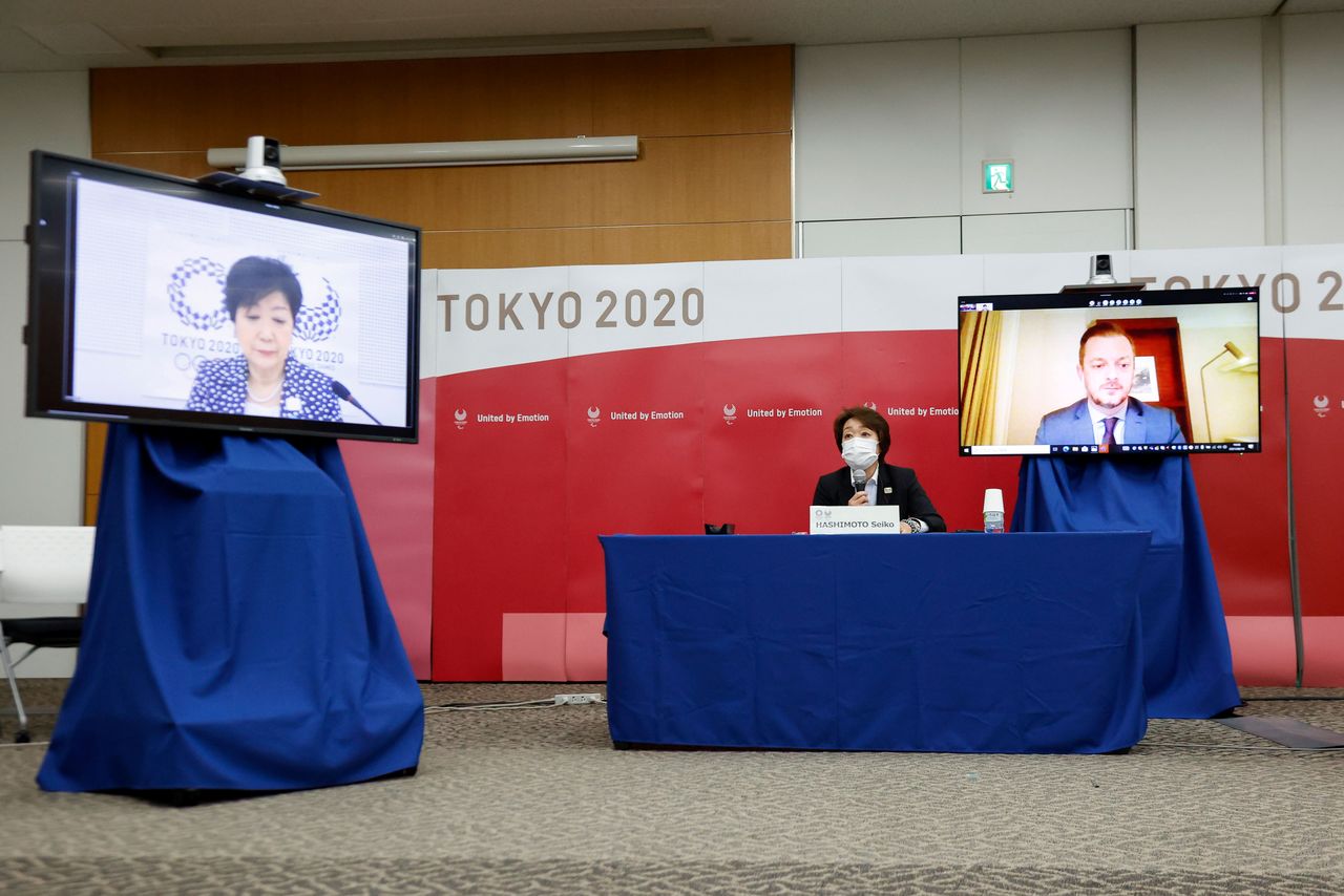 Tokyo Governor Yuriko Koike, Seiko Hashimoto, President of Tokyo 2020, and Andrew Parsons, IPC President, speak during a four-party meeting at Harumi Island Triton Square Tower Y in Tokyo, Japan August 16, 2021. Rodrigo Reyes Marin/Pool via REUTERS